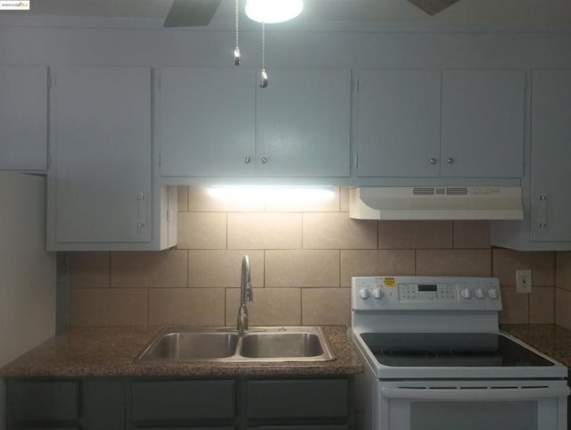 kitchen featuring electric stove, sink, and tasteful backsplash