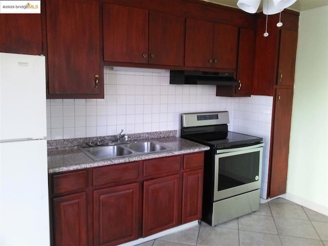 kitchen with stainless steel electric stove, extractor fan, sink, decorative backsplash, and white fridge