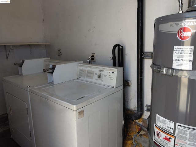 laundry area with separate washer and dryer and water heater