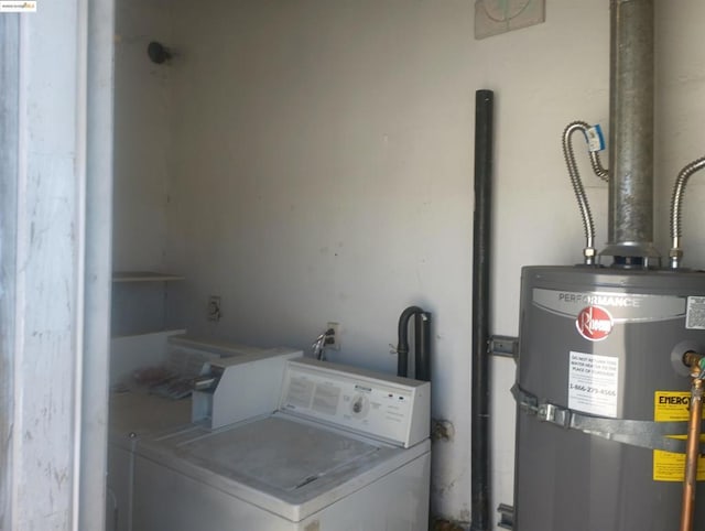 washroom featuring washer / clothes dryer and secured water heater