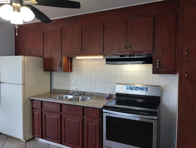 kitchen featuring ventilation hood, sink, backsplash, white refrigerator, and electric range