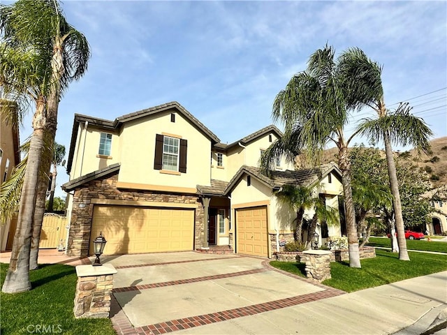 view of front of home featuring a garage and a front lawn