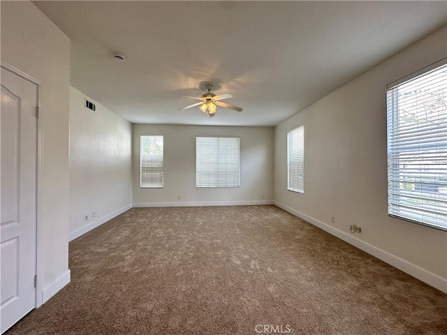 carpeted empty room with ceiling fan