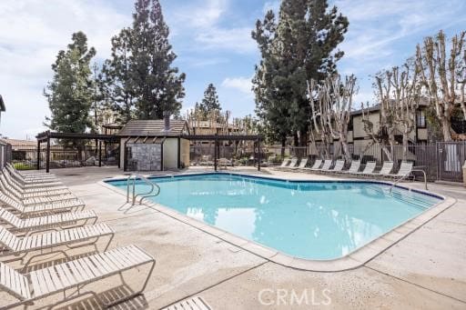 view of swimming pool with a patio area