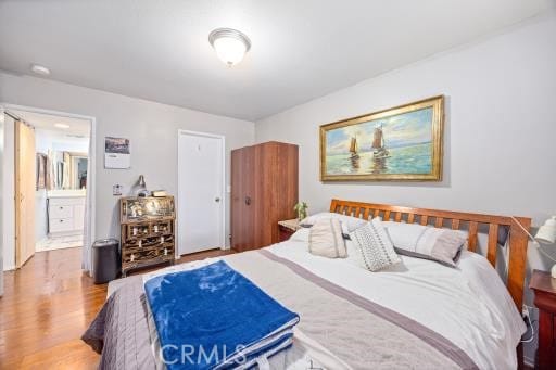 bedroom featuring wood-type flooring