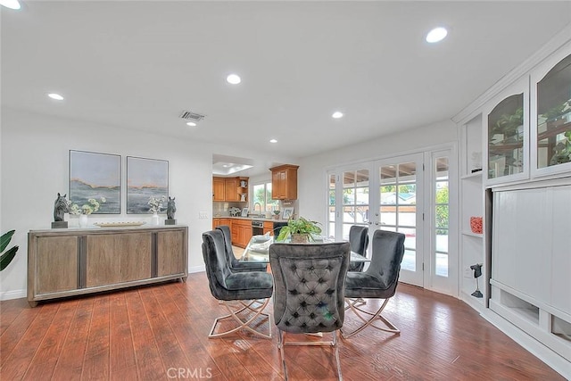 dining room with dark wood-type flooring and french doors