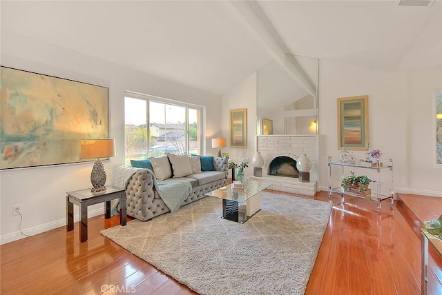 living room with wood-type flooring and lofted ceiling with beams