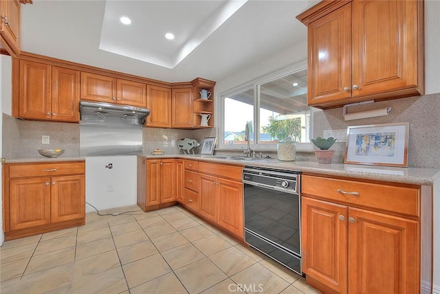 kitchen featuring tasteful backsplash, sink, light tile patterned floors, and dishwasher