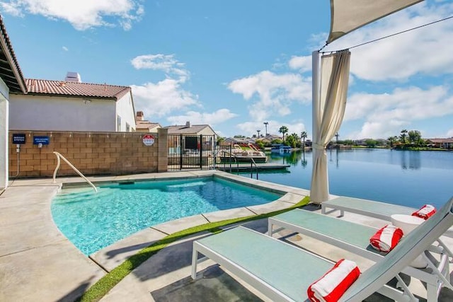 view of pool with a water view