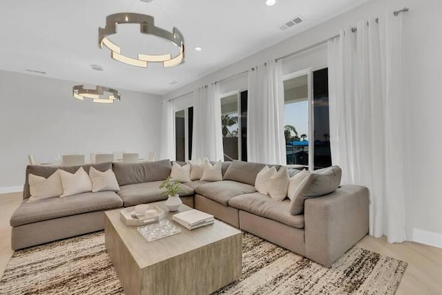 living room with light hardwood / wood-style flooring