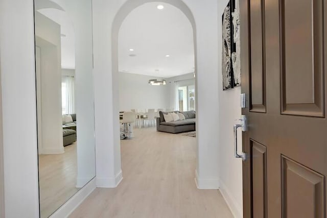 entryway featuring a healthy amount of sunlight and light hardwood / wood-style floors