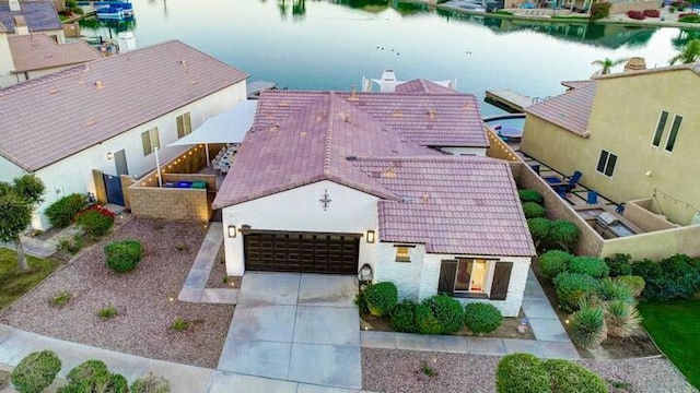 birds eye view of property featuring a water view