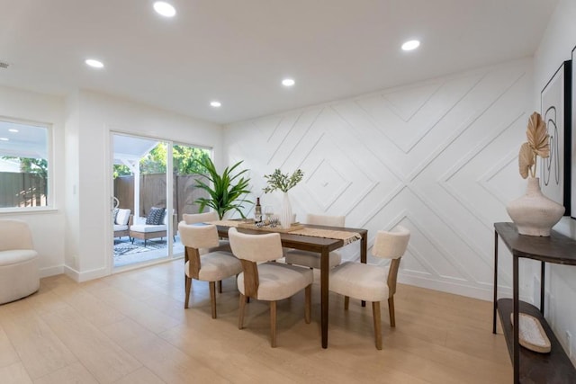 dining area with light hardwood / wood-style flooring