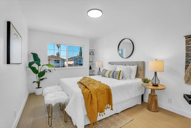 bedroom with wood-type flooring