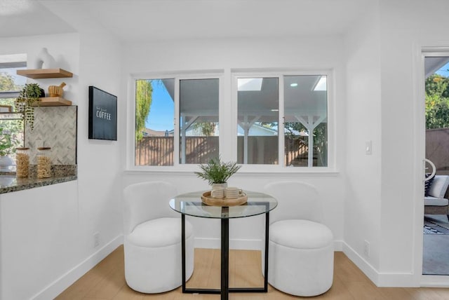 dining space with light hardwood / wood-style floors