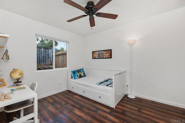 bedroom with dark wood-type flooring and ceiling fan