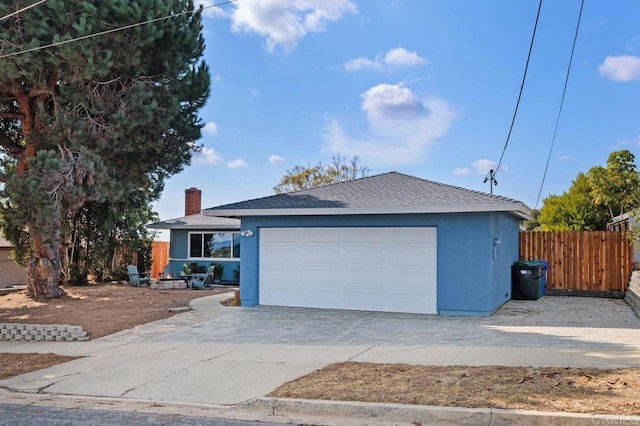 ranch-style house featuring a garage