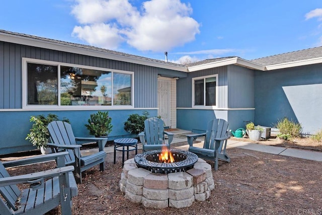 view of patio / terrace featuring a fire pit