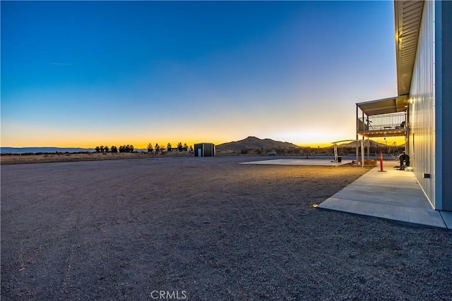 yard at dusk with a mountain view