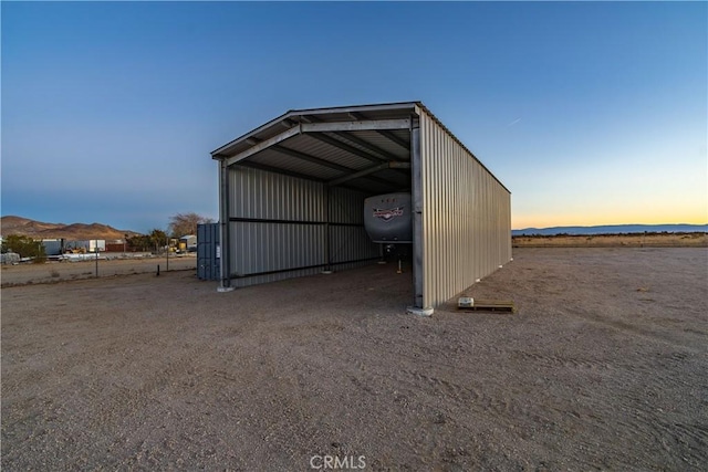 outdoor structure at dusk with a mountain view