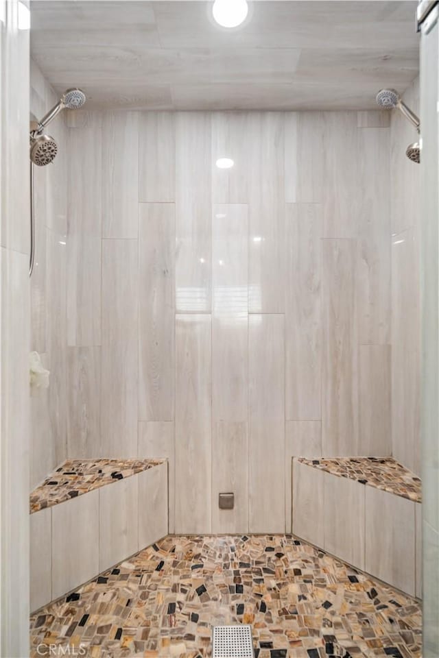 bathroom with tiled shower