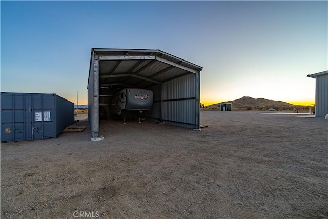 outdoor structure at dusk with a mountain view