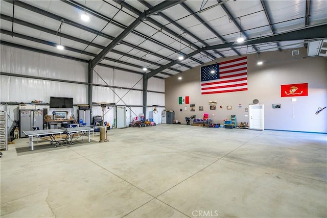 garage featuring stainless steel fridge