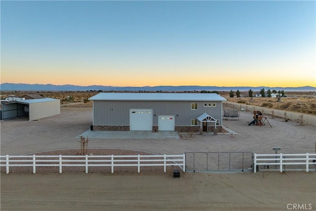 exterior space with a mountain view and an outdoor structure