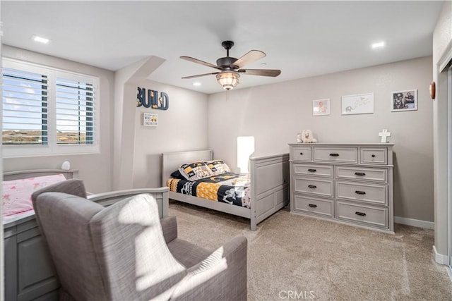 carpeted bedroom featuring ceiling fan