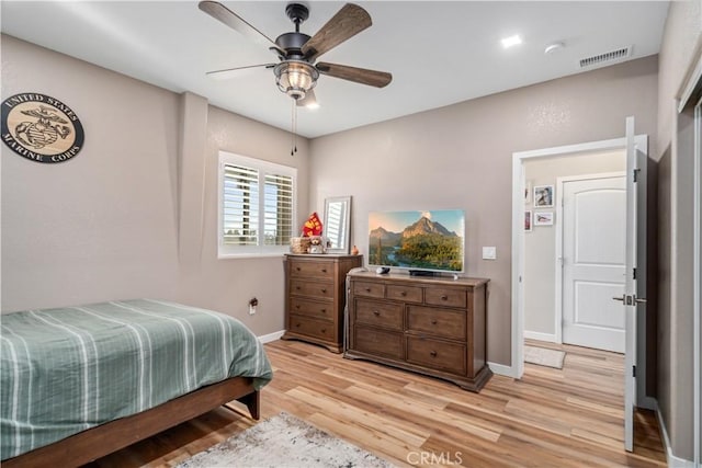 bedroom featuring light wood-type flooring and ceiling fan