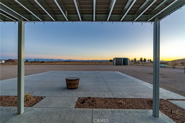 patio terrace at dusk with a mountain view