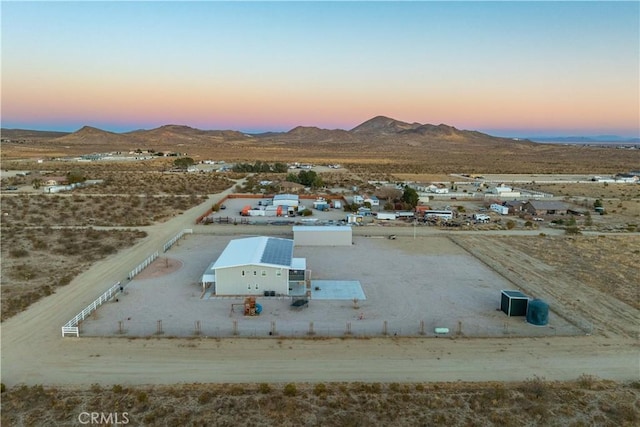 aerial view at dusk with a mountain view