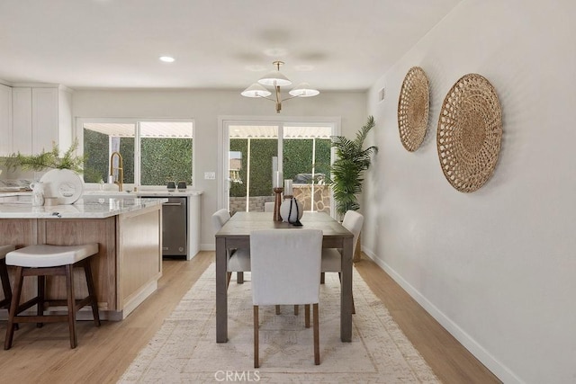 dining area with light hardwood / wood-style flooring