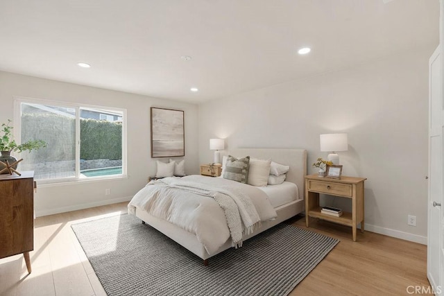 bedroom with light hardwood / wood-style flooring