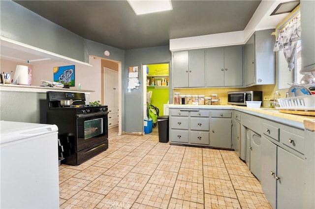 kitchen featuring black range with gas cooktop