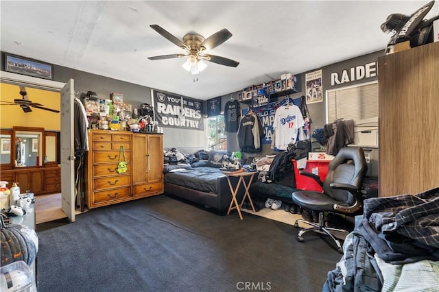 carpeted bedroom featuring ceiling fan