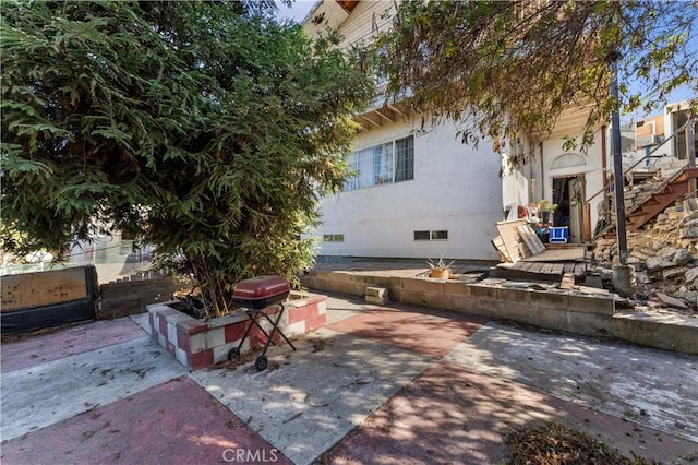 view of side of home with a patio