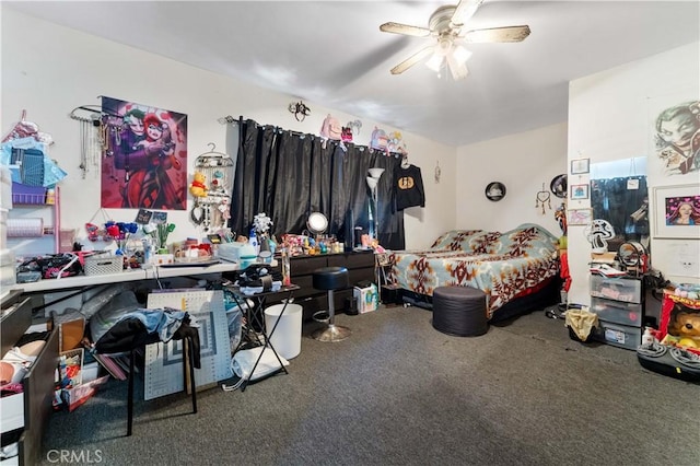 bedroom featuring ceiling fan and carpet