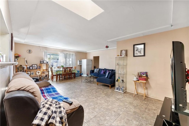 living room featuring a skylight