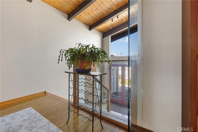 room details featuring beamed ceiling, wood-type flooring, and wooden ceiling