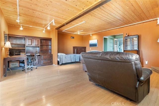 bedroom with track lighting, light hardwood / wood-style flooring, and wooden ceiling