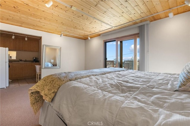 bedroom featuring access to outside, carpet, white fridge, and wooden ceiling