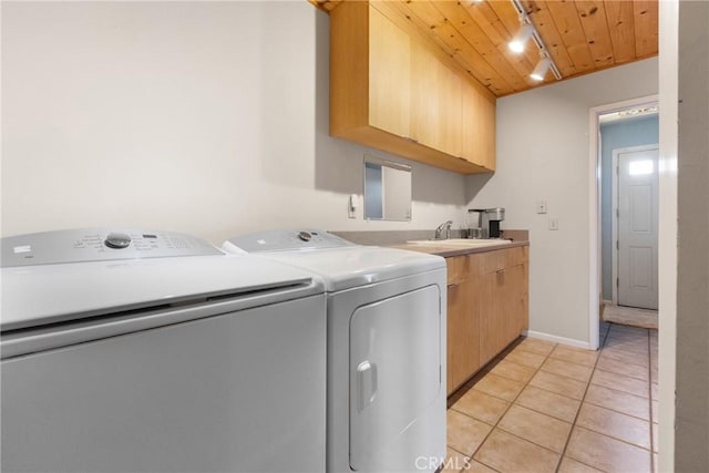 laundry room with separate washer and dryer, sink, cabinets, track lighting, and wooden ceiling