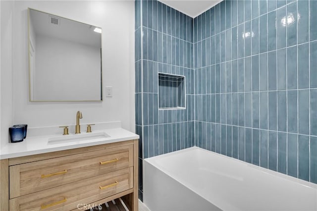 bathroom with vanity and  shower combination