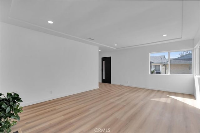 empty room with light hardwood / wood-style floors