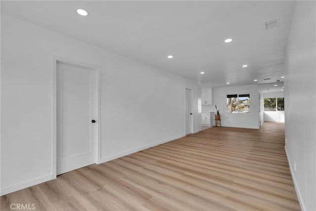 unfurnished room featuring light hardwood / wood-style floors