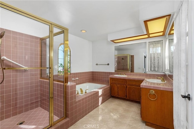 bathroom featuring vanity, separate shower and tub, and tile patterned floors