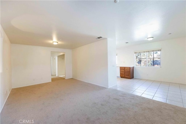 empty room featuring light colored carpet