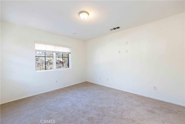 empty room featuring carpet floors