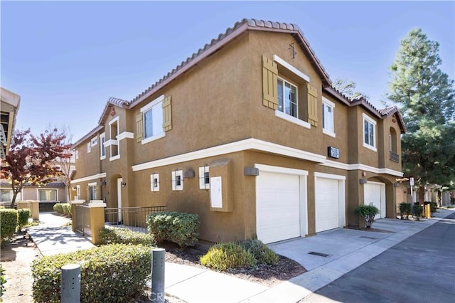 view of side of property with a garage